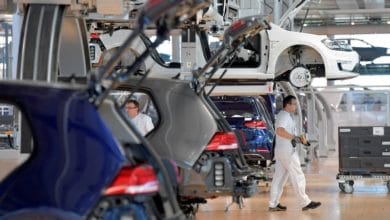 Gas-guzzling German carmakers face uphill struggle to go green