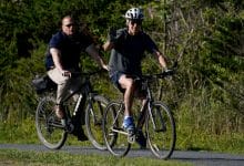 Biden flubs bike dismount, falls, but uninjured