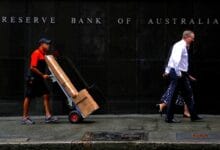 Australia’s central bank says to raise rates further, on pace with global peers