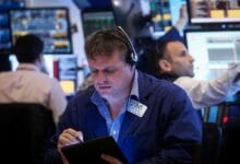 Wall St slips as mixed data fuels Fed policy uncertainty