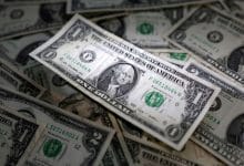 Dollar finds footing on housing data as yuan falters