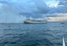 Car carrier still burning off Dutch coast as hunt for cause begins