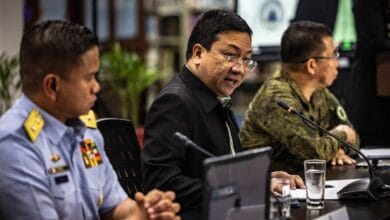 Philippines tells China it will not abandon post in disputed reef