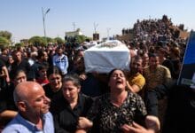 Mourners demand accountability, bury loved ones after Iraq wedding inferno