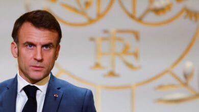 Macron defends new French migration law despite political tensions