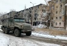 Ukrainian soldiers expect more assaults after Russian forces capture eastern town